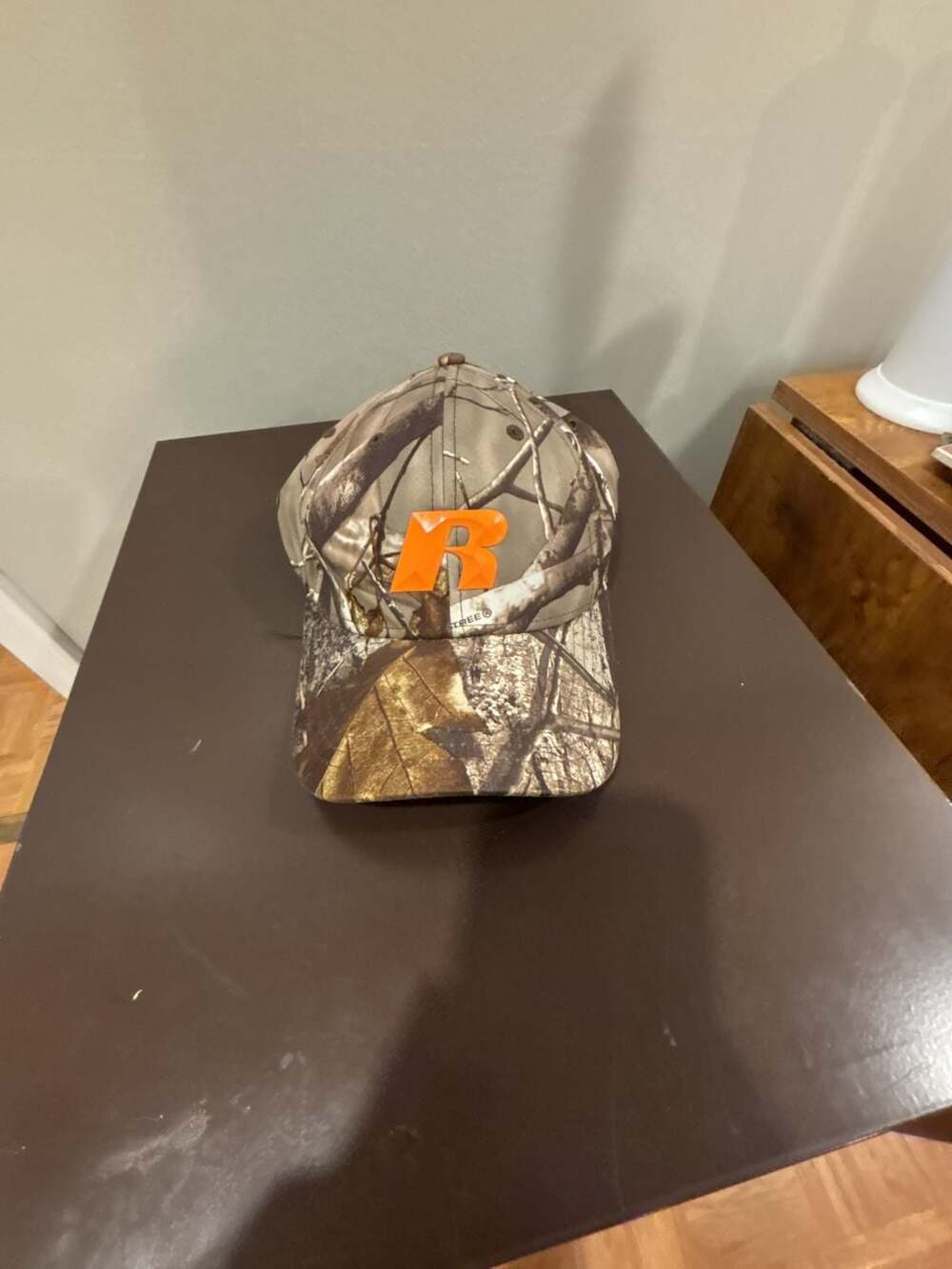 Russell Athletic Realtree Camo Baseball Cap with Orange Logo